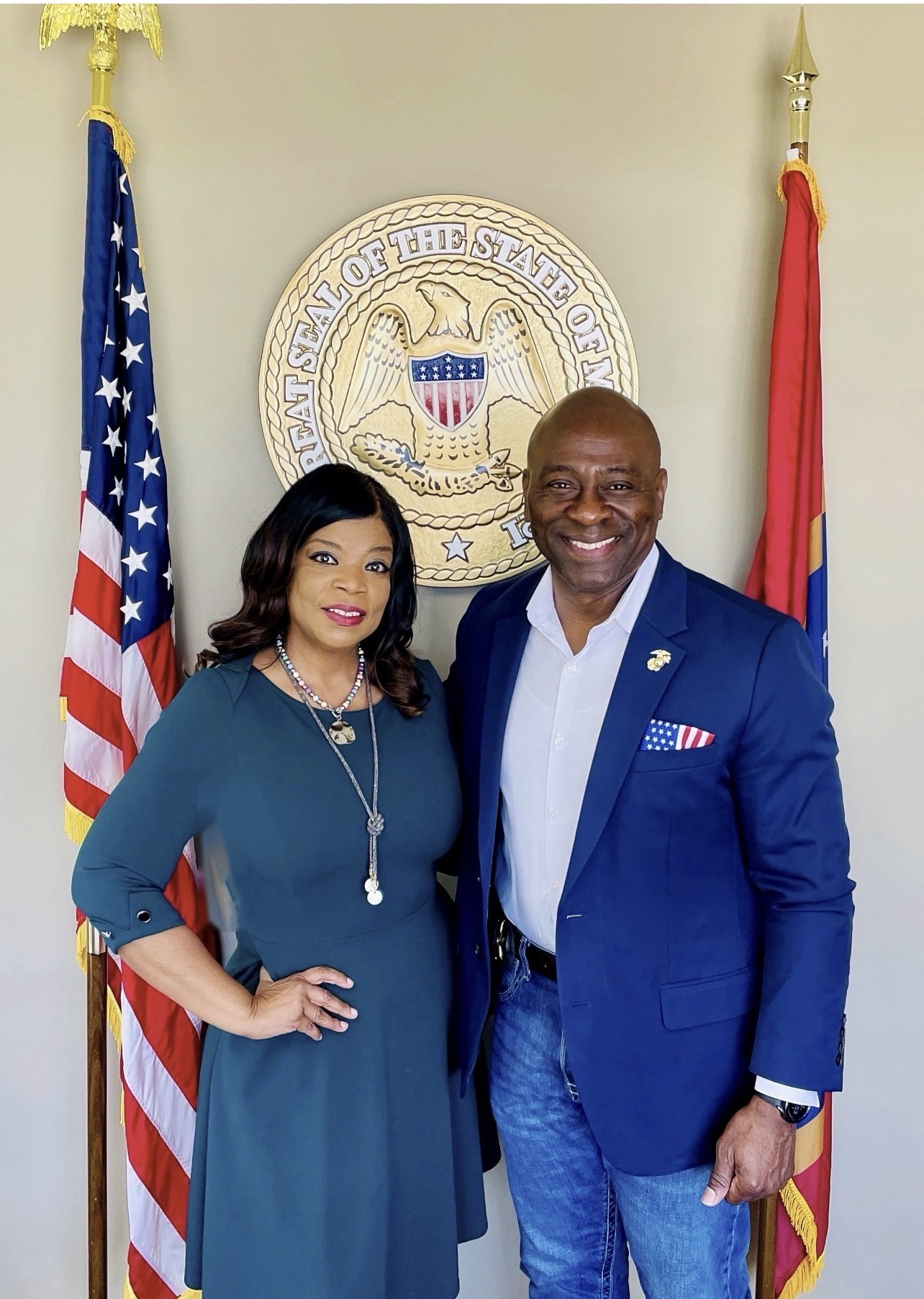 With Sheriff Tuggle at the Mississippi state seal